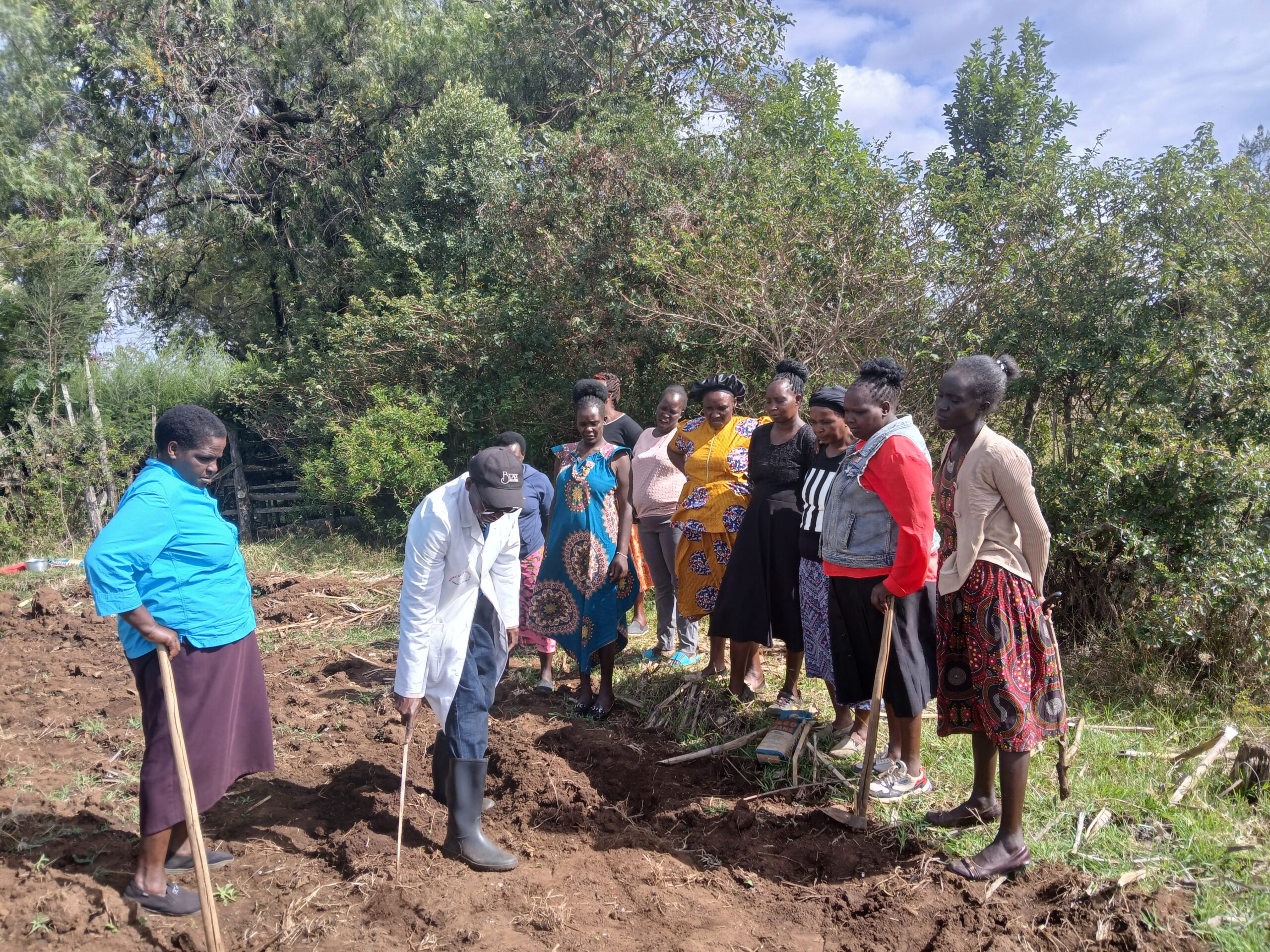 Farm demonstration for Solian women by Agricultural Officer Mr. Yego